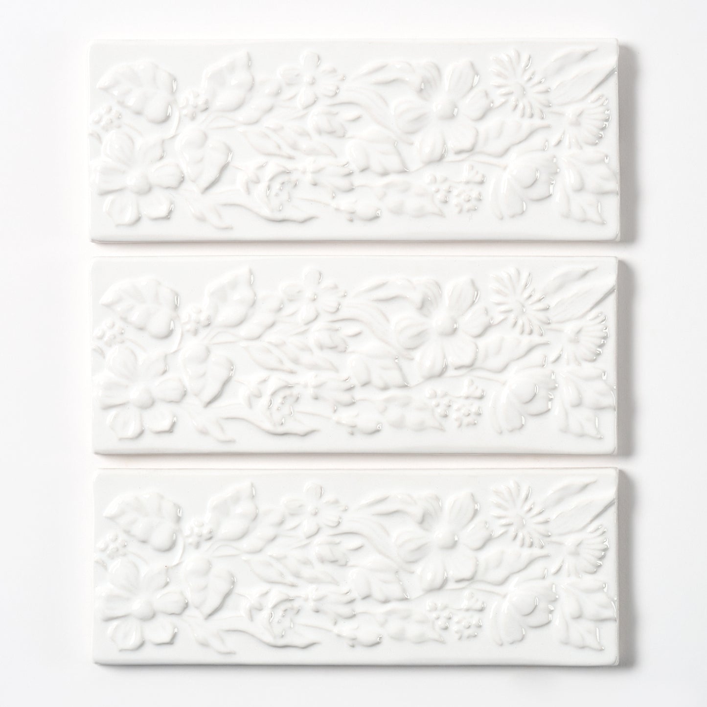 1980s Vintage Italian Raised White Floral Border Tile, 104 Linear Ft Available - 26 Linear Ft Per Box