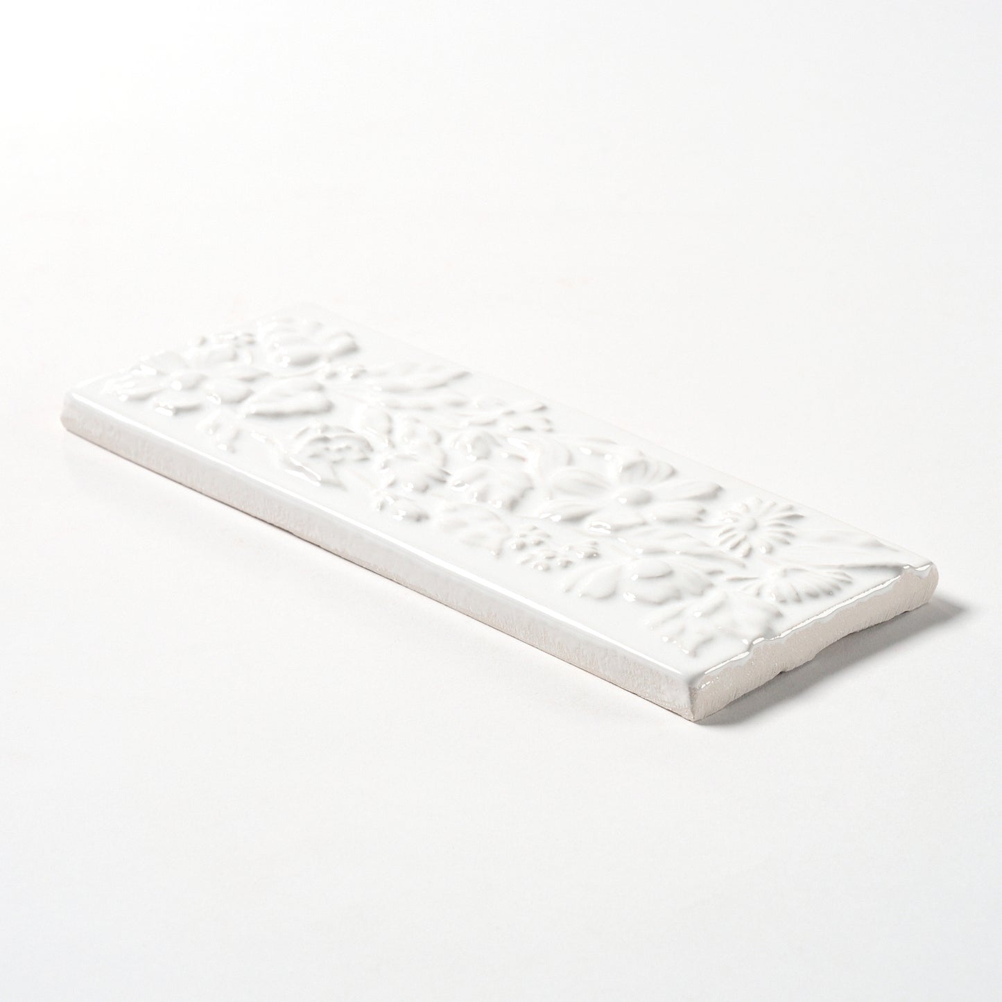 1980s Vintage Italian Raised White Floral Border Tile, 104 Linear Ft Available - 26 Linear Ft Per Box