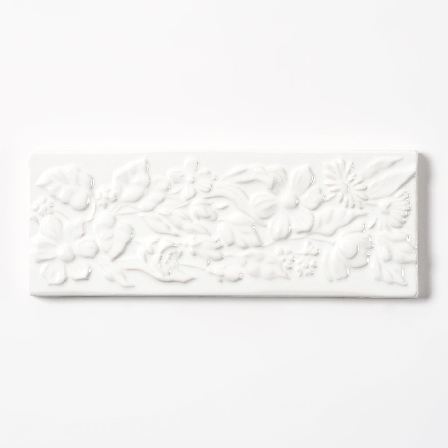 1980s Vintage Italian Raised White Floral Border Tile, 104 Linear Ft Available - 26 Linear Ft Per Box