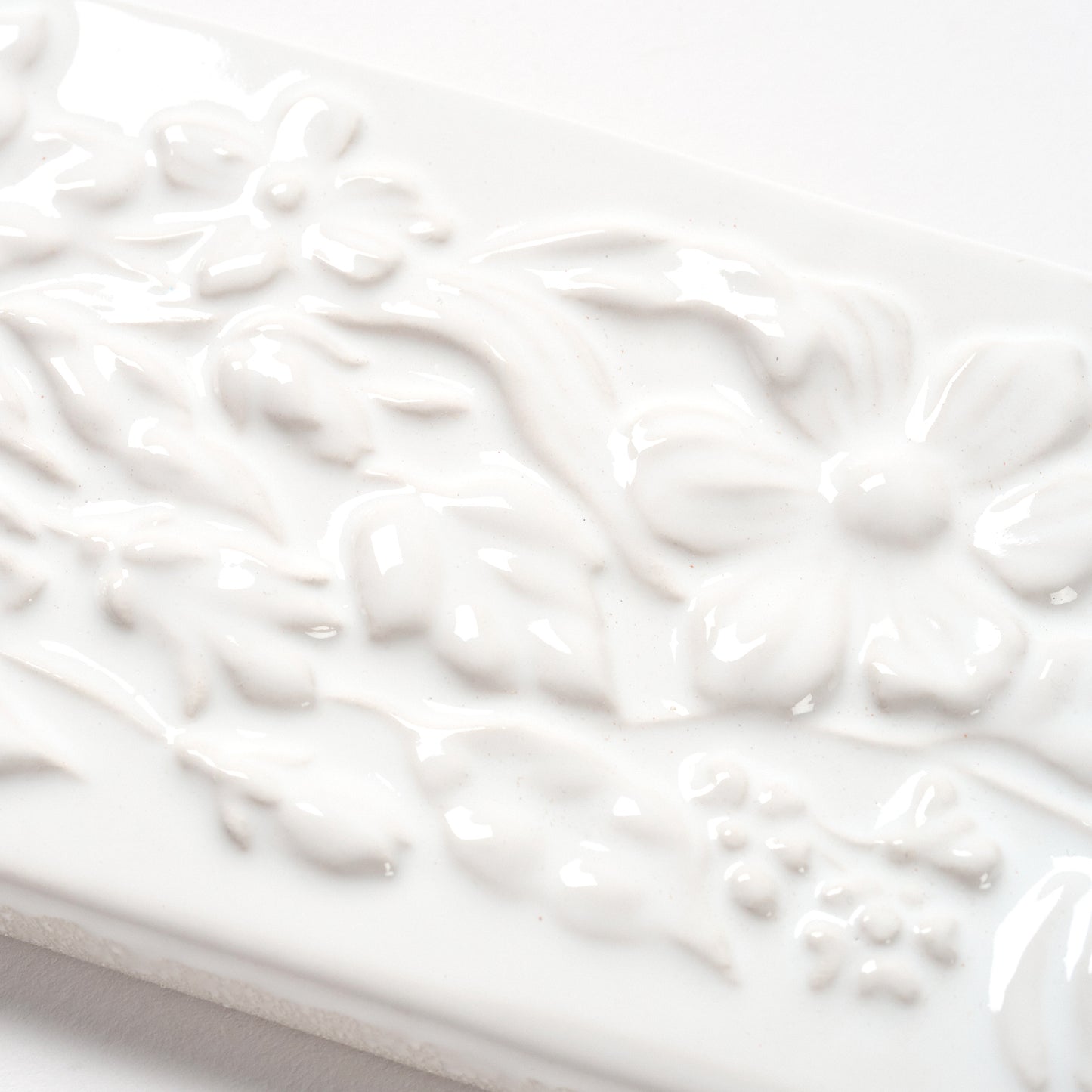 1980s Vintage Italian Raised White Floral Border Tile, 104 Linear Ft Available - 26 Linear Ft Per Box